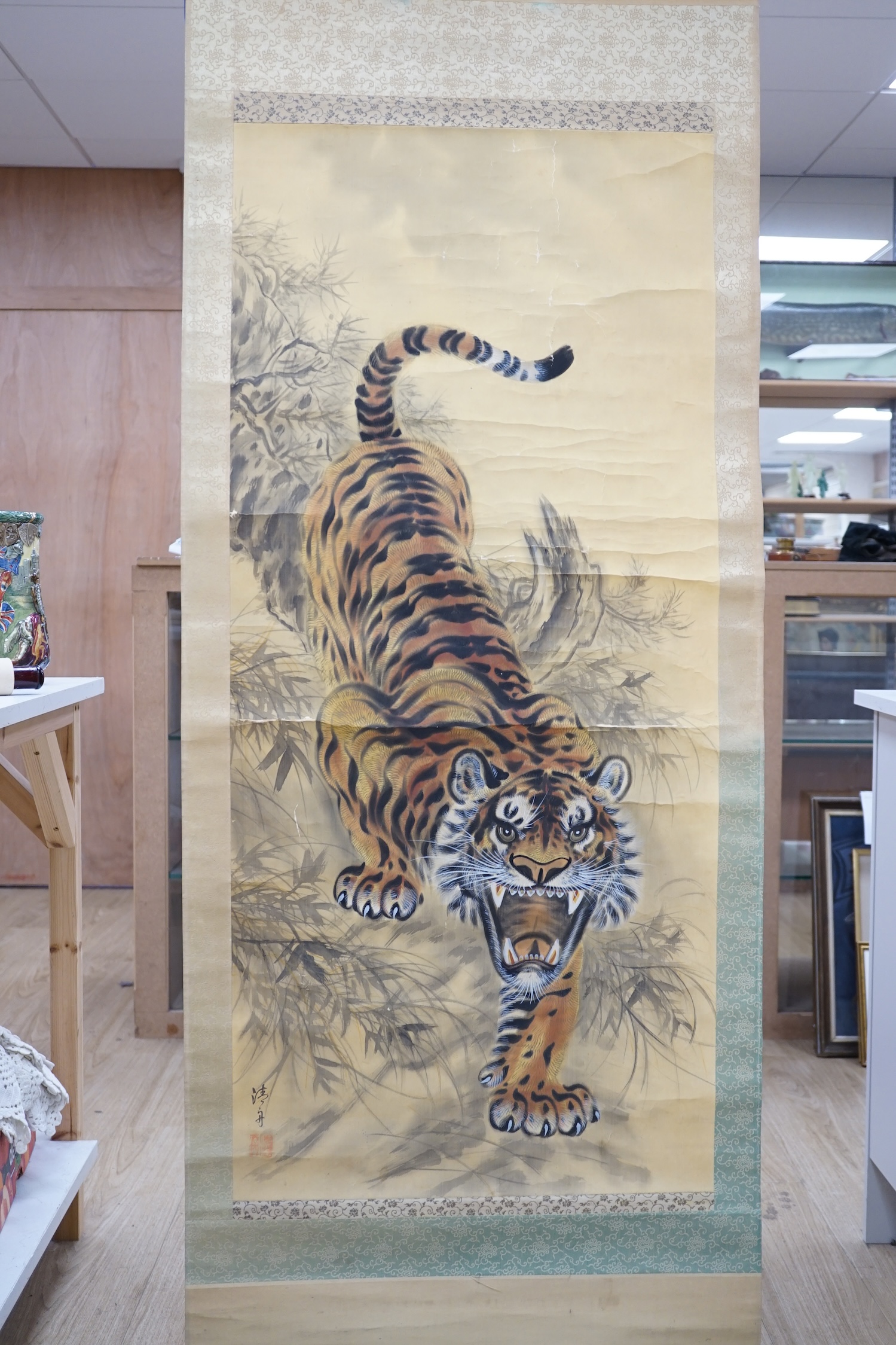 A Japanese ‘tiger’ scroll painting. Condition - fair